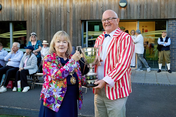 The Sheriff of Lichfield presents the winning cup to the captain of the bowls team