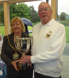 Mayor of Lichfield, Cllr Janet Eagland, hands the trophy to Hank Vyse of the Bowling Club.