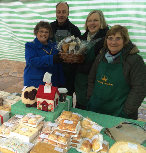 Cllr Norma Bacon, presented the stall holders with a basket of assorted chocolate treats
