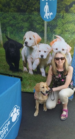 Janice Greaves by guidedog sign